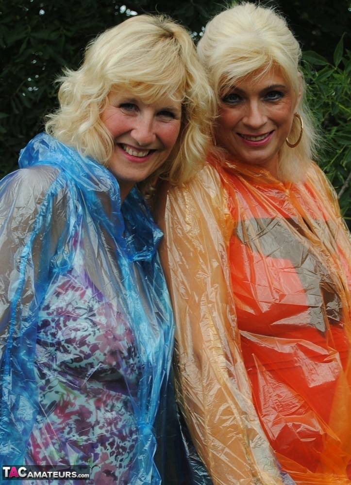 Mature lesbian Dimonty and GF cover their naked bodies in see thru raincoats - #16