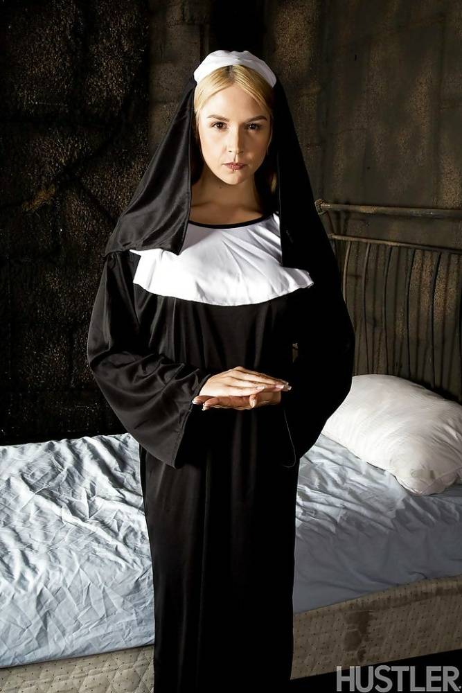 Blonde babe Sara Sloane strips off nun's uniform to expose big tits - #16