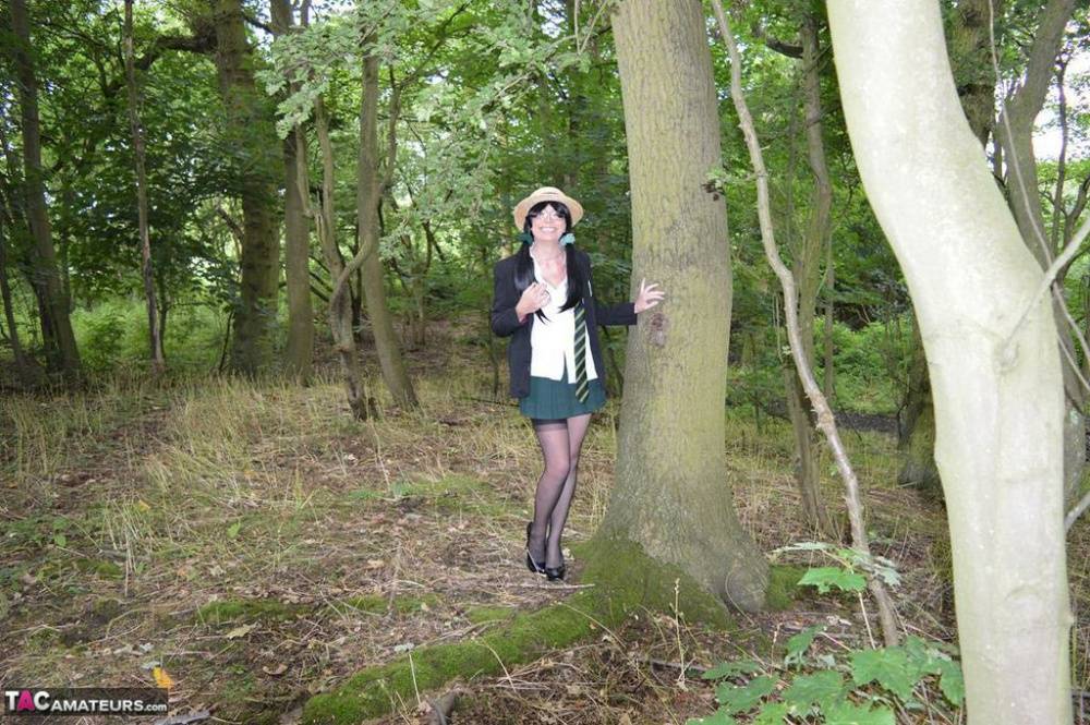 Older amateur Barby Slut exposes herself in the woods in schoolgirl apparel - #7