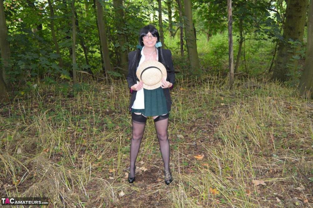 Older amateur Barby Slut exposes herself in the woods in schoolgirl apparel - #11