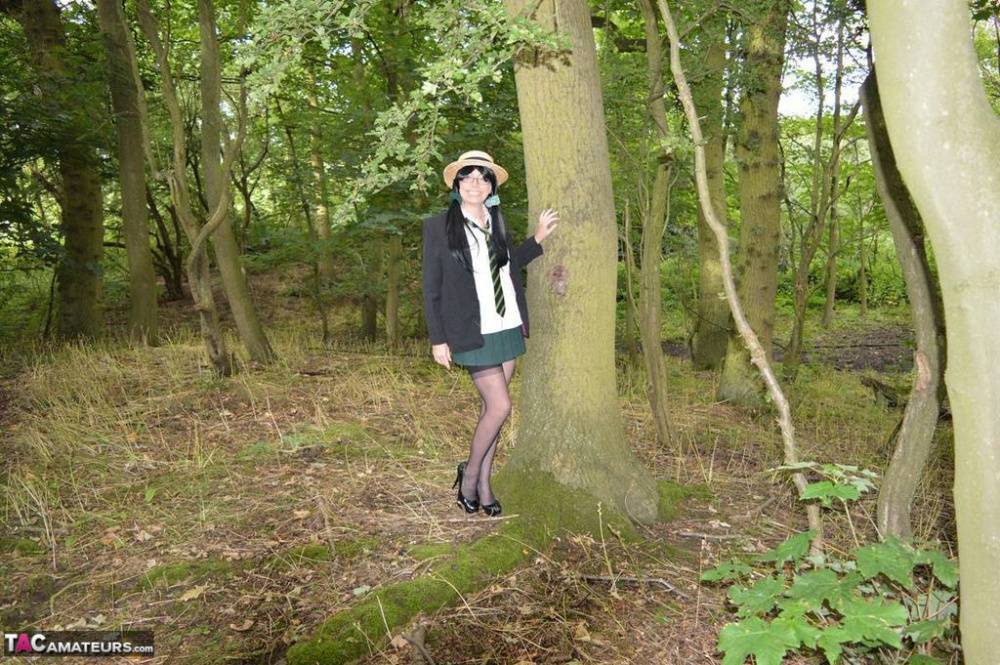 Older amateur Barby Slut exposes herself in the woods in schoolgirl apparel - #9