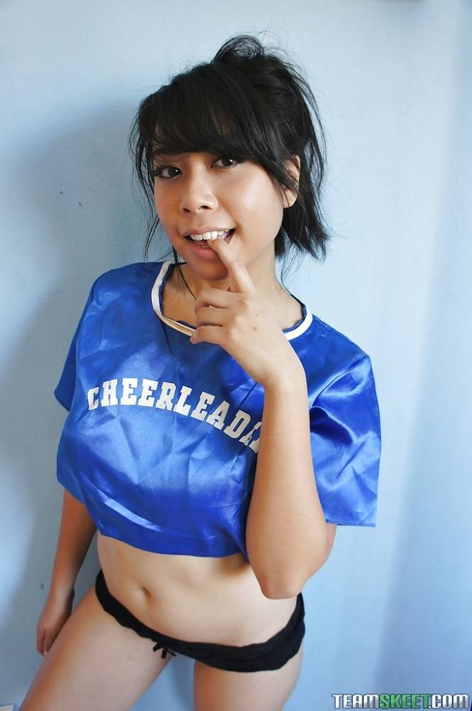 Petite Oriental cheerleader May Lee flashing black panties under skirt - #10