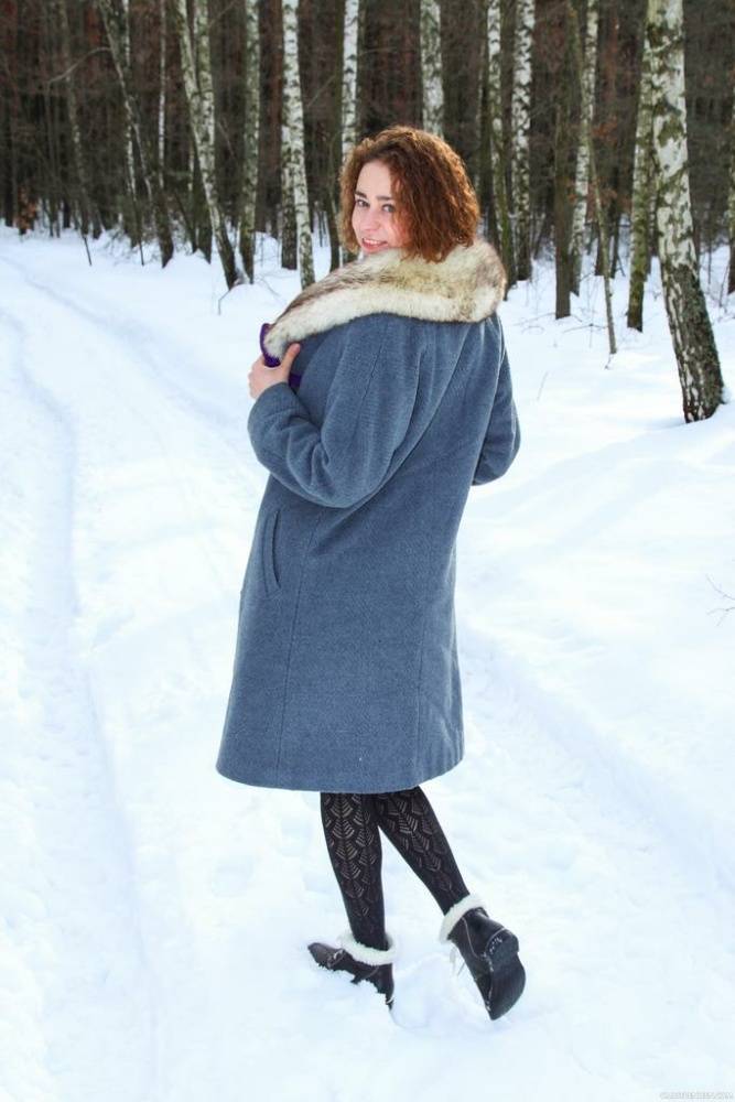 Petite teen girl Lola F strips naked on snow covered path next to the woods - #6