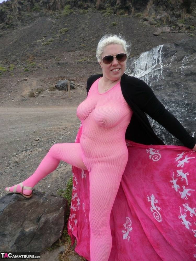 Aged lady Barby looses her big tits from a crotchless bodystocking by the sea - #1