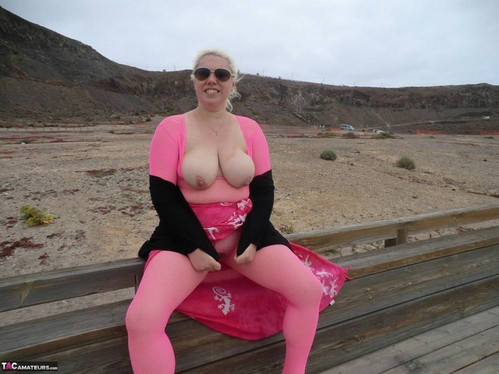 Aged lady Barby looses her big tits from a crotchless bodystocking by the sea - #15
