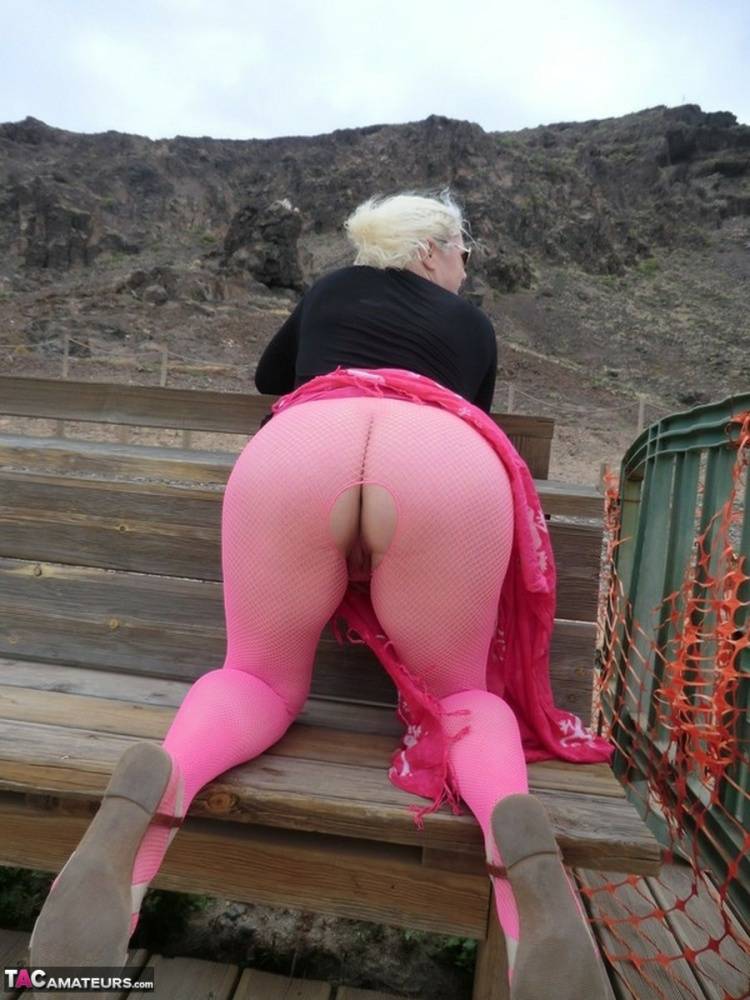 Aged lady Barby looses her big tits from a crotchless bodystocking by the sea - #10