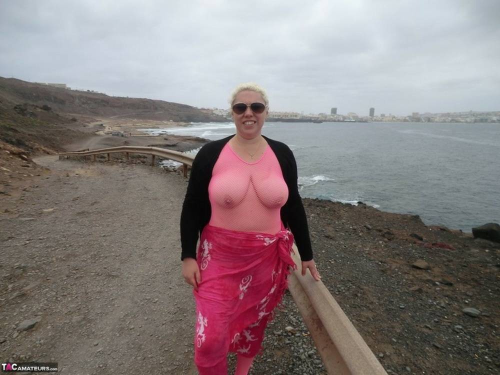 Aged lady Barby looses her big tits from a crotchless bodystocking by the sea - #16