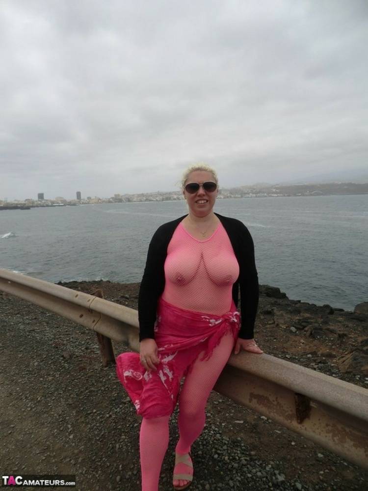 Aged lady Barby looses her big tits from a crotchless bodystocking by the sea - #4