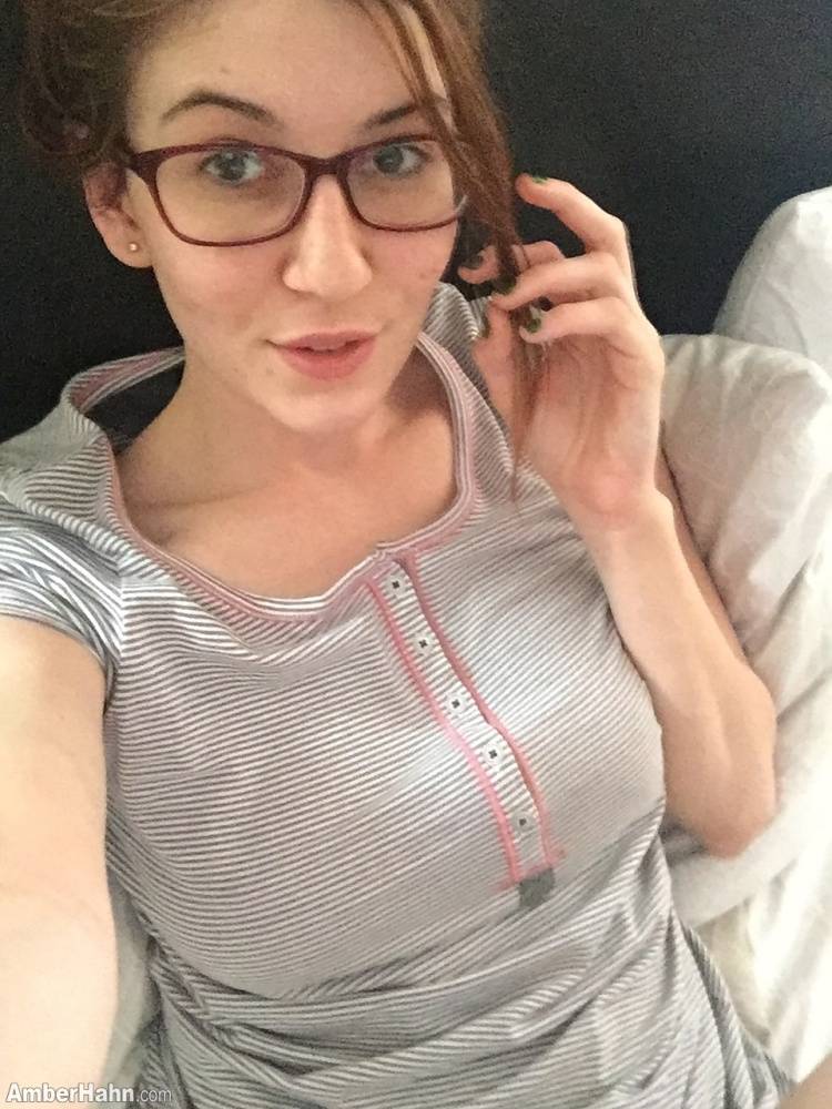 Nerdy female Amber Hahn exposes her hooters for self shots on bed - #4