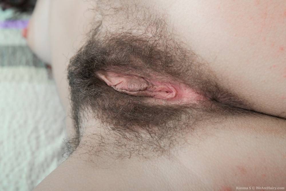 Solo girl Rimma S undresses for viewing off her naturally hairy vagina - #1