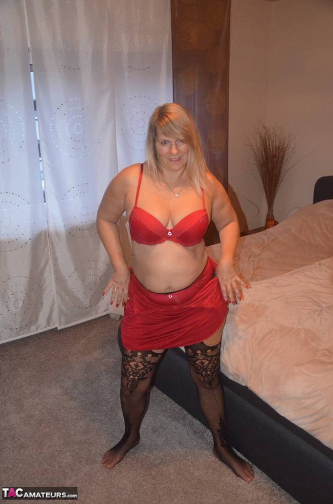 Mature amateur doffs red dress to show her ass and twat in sexy stockings - #8