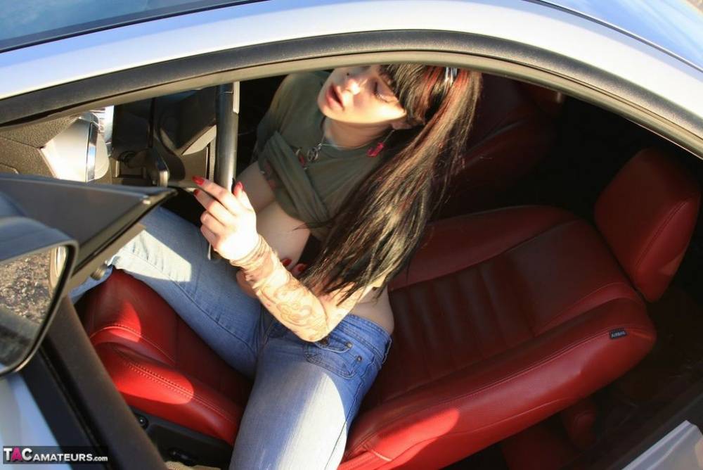 Amateur girl Susy Rocks flips the bird while exposing her big tits in a car - #4