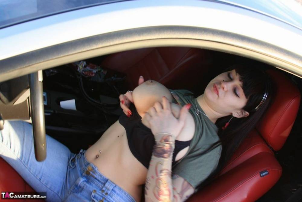 Amateur girl Susy Rocks flips the bird while exposing her big tits in a car - #3