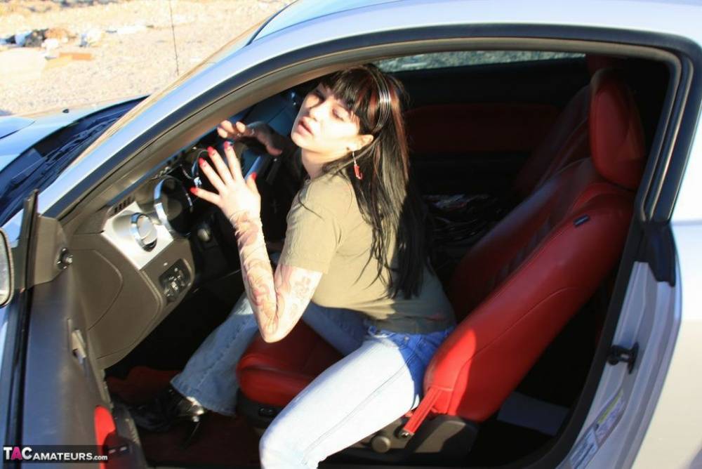 Amateur girl Susy Rocks flips the bird while exposing her big tits in a car - #12
