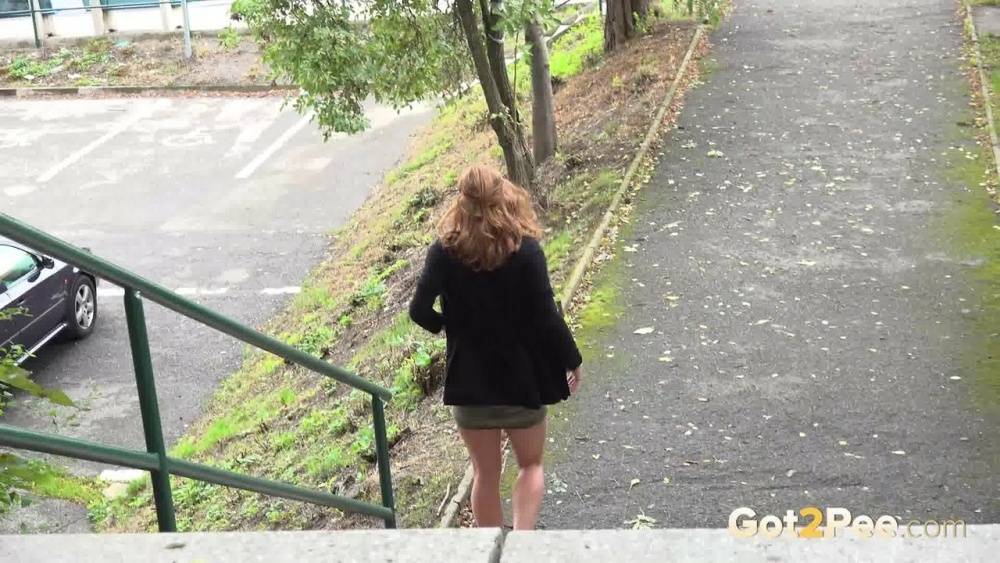 Natural redhead Chrissy Fox squats for a pee on a set of public steps - #10