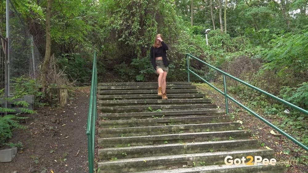 Natural redhead Chrissy Fox squats for a pee on a set of public steps - #15
