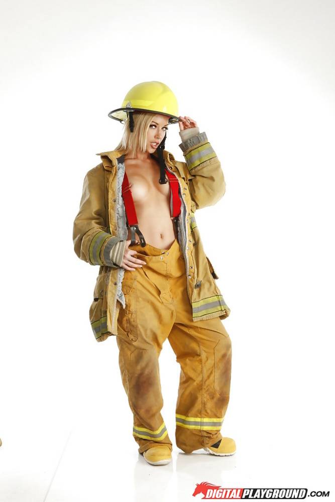 Skinny blonde babe is revealing her tremendous body in a fireman uniform - #13