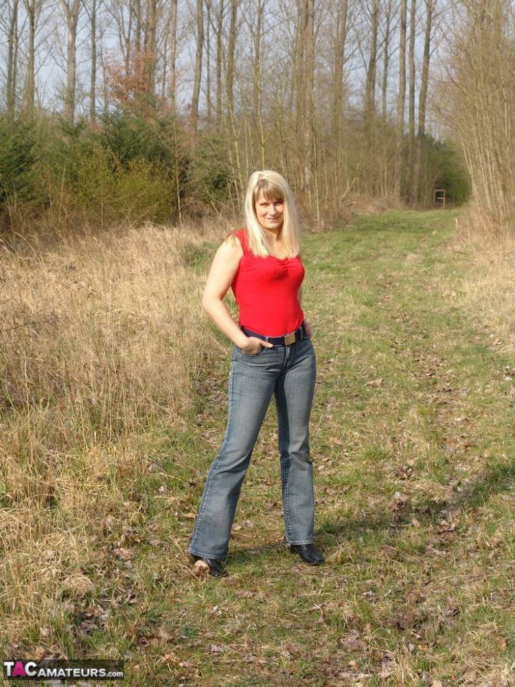 Curvy blonde Sweet Susi pulls out a smoke after getting naked in woods - #12