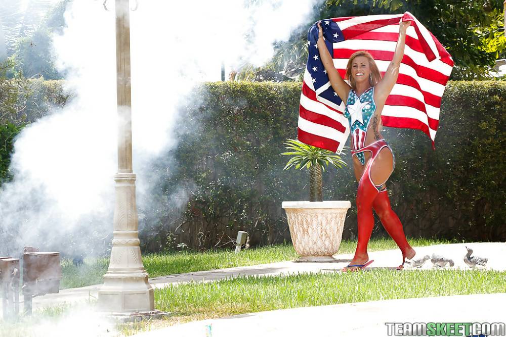 Curvy blonde amateur Kelsi Monroe posing outdoors in USA themed stockings - #16