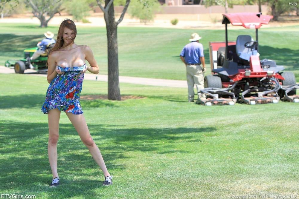 Cute redhead bare her tits on a golf course before spreading her pussy lips - #2