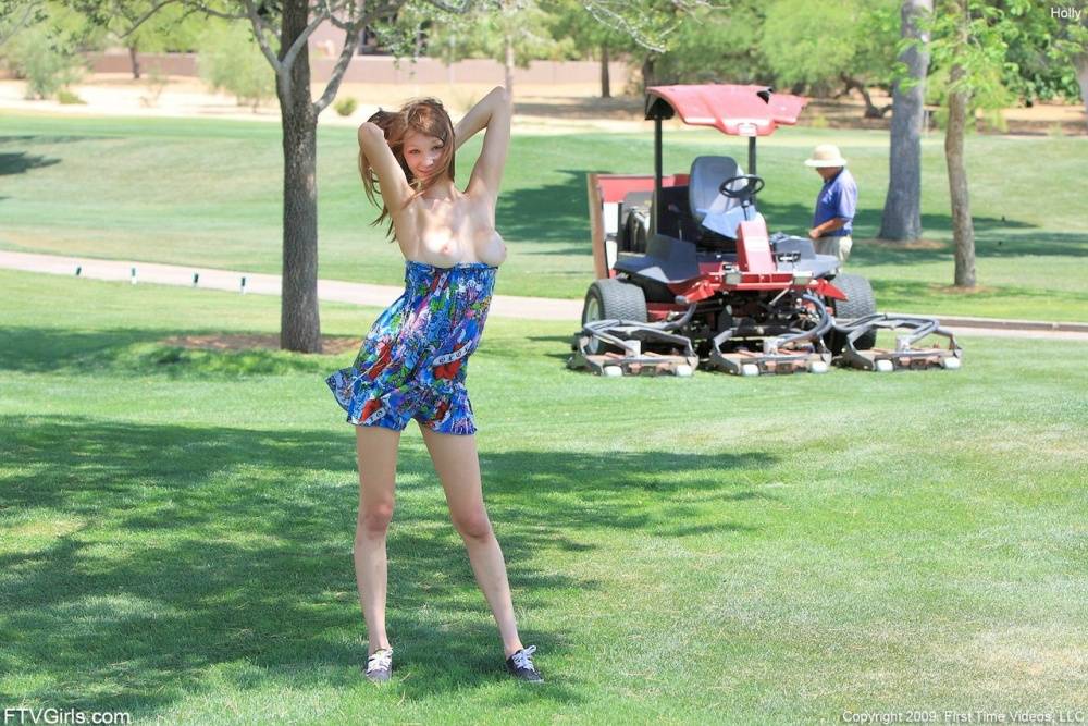 Cute redhead bare her tits on a golf course before spreading her pussy lips - #6