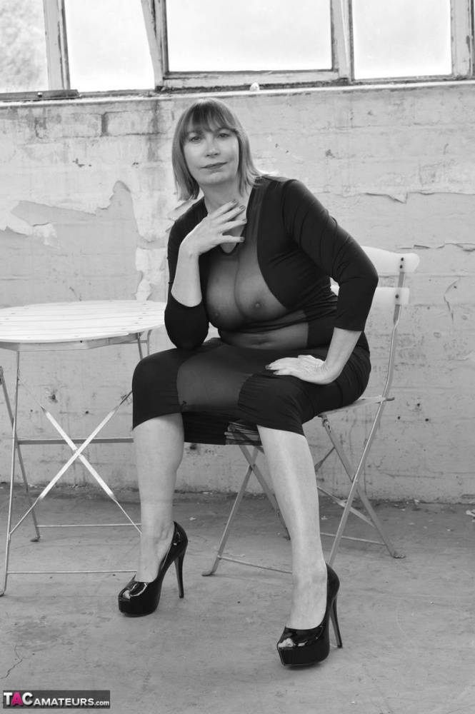 Middle-aged woman Barby Slut models a see-thru dress for a black-and-white gig - #3