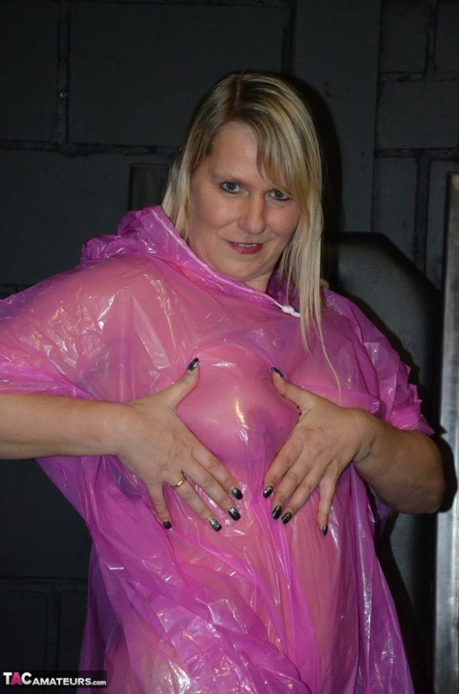 Blonde amateur Sweet Susi releases her tits and twat from a see thru raincoat - #2