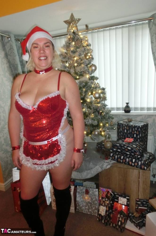 Busty blonde Barby masturbates her shaved pussy near the Christmas tree - #9