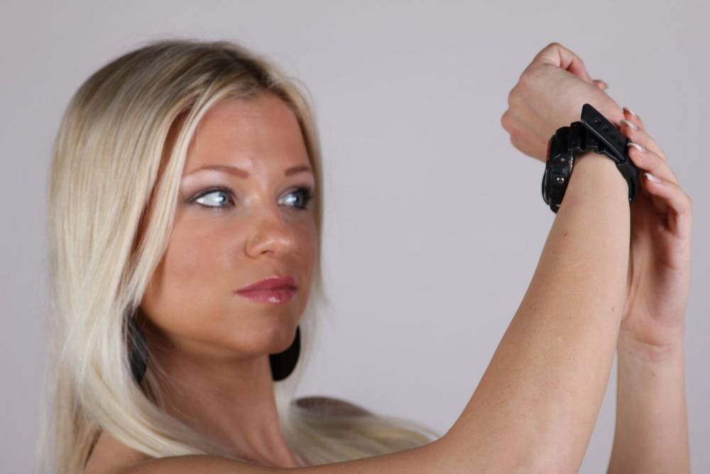 Blonde model Brittany displays her black G-Shock watch during a SFW gig - #4