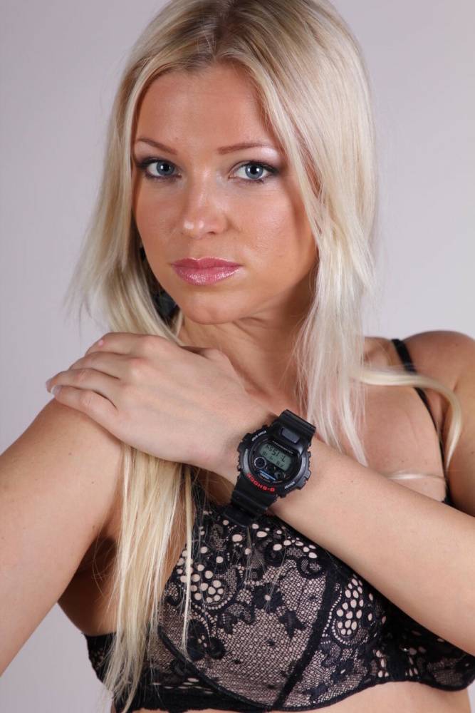 Blonde model Brittany displays her black G-Shock watch during a SFW gig - #16