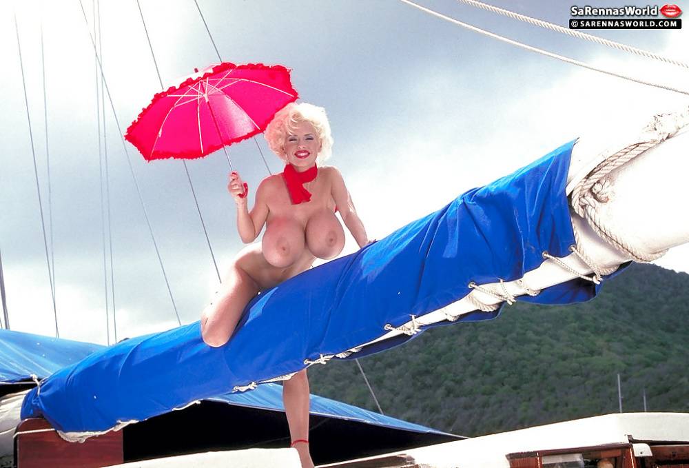 Platinum blonde pornstar SaRenna Lee loosing hooters outdoors on houseboat - #16