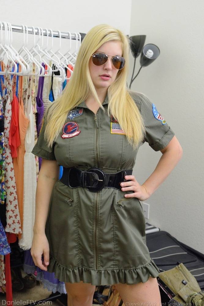 Busty blonde Danielle flashes her big tits and bald pussy in the uniform shop - #13
