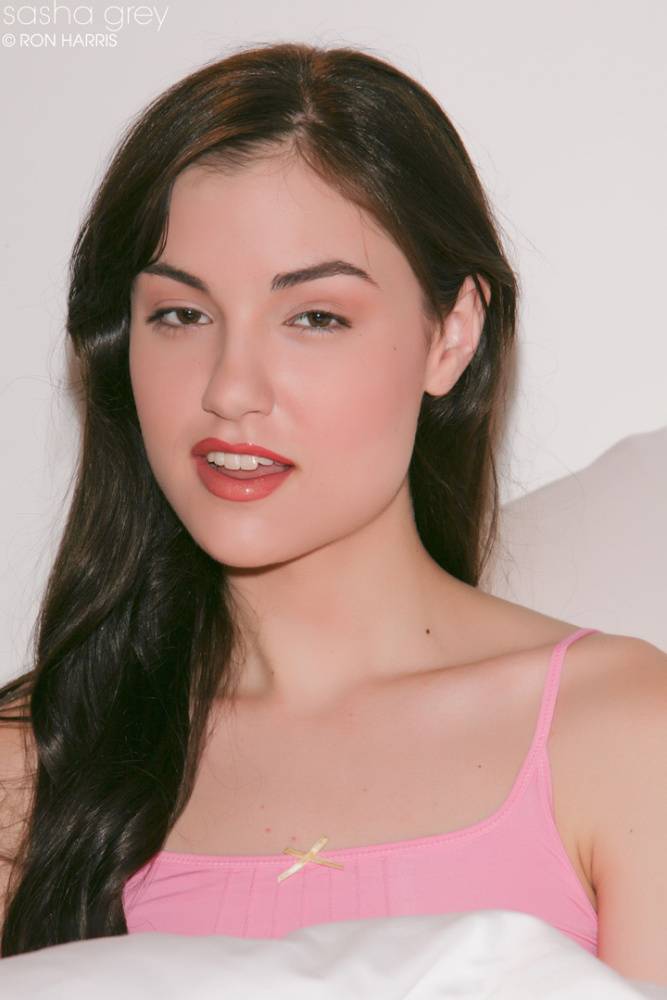 Brunette Sasha Grey lifts her pink shirt to flaunt tiny tits & small nipples - #15
