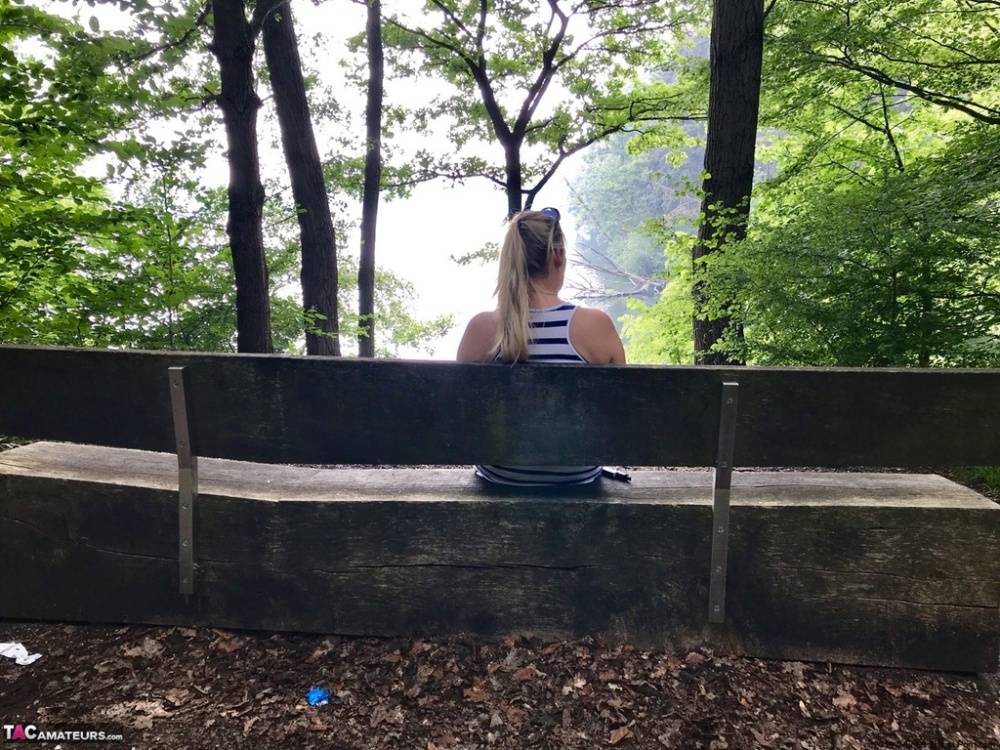 Mature amateur shows her big boobs and butt on bench in the forest - #10