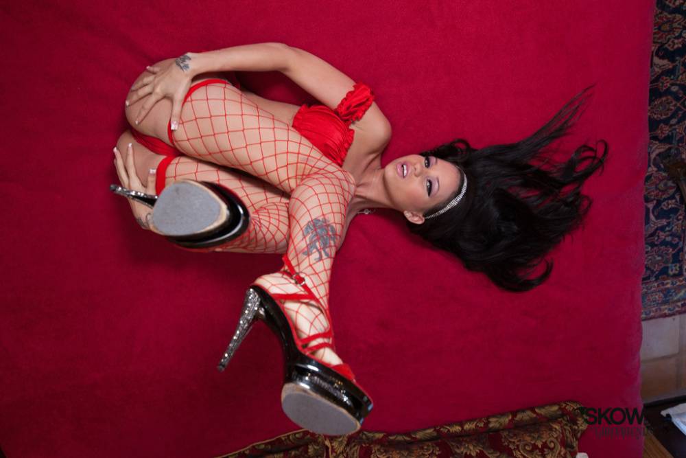 Dark haired model Raven Bay shows off her big tits in fishnet stockings - #5