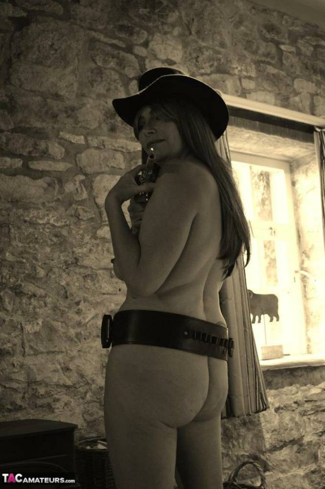 Busty amateur Barby Slut poses for a black-and-white Western themed shoot - #11