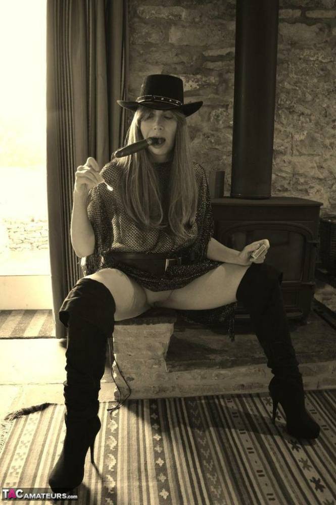 Busty amateur Barby Slut poses for a black-and-white Western themed shoot - #16