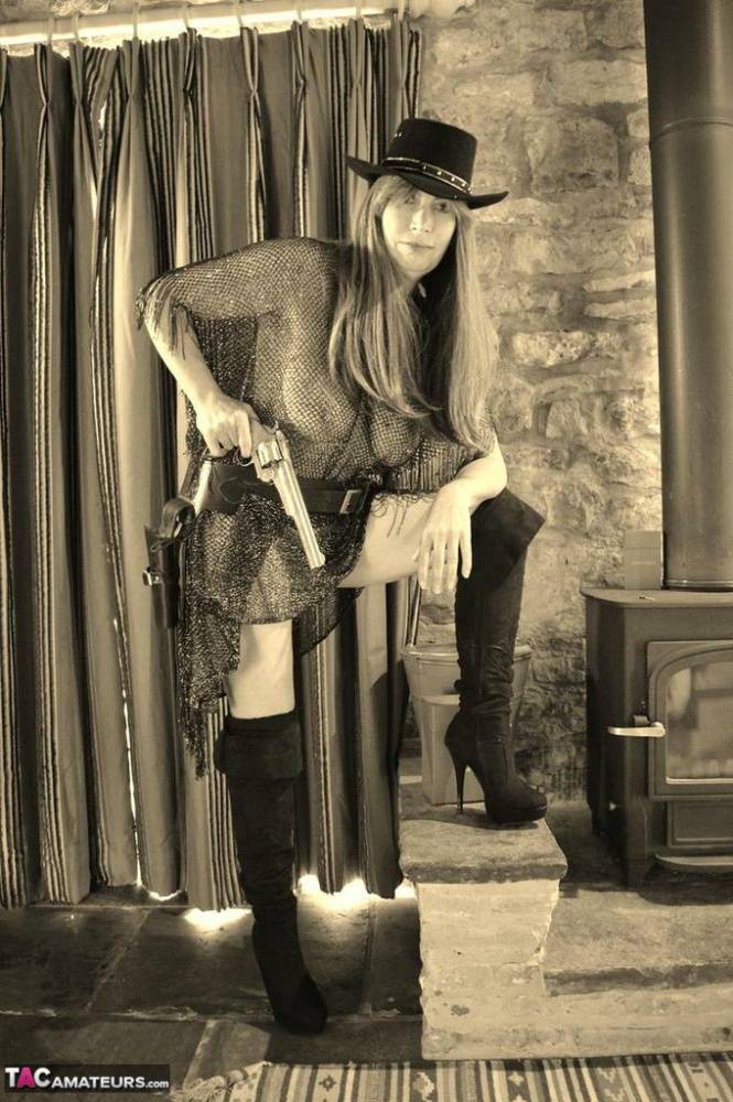 Busty amateur Barby Slut poses for a black-and-white Western themed shoot - #12