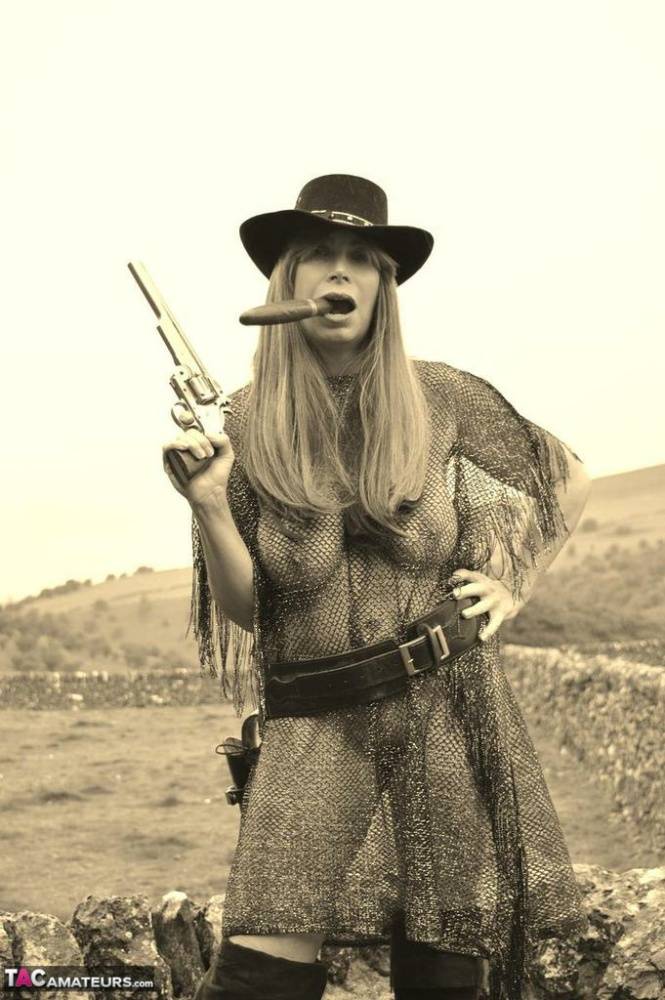 Busty amateur Barby Slut poses for a black-and-white Western themed shoot - #14