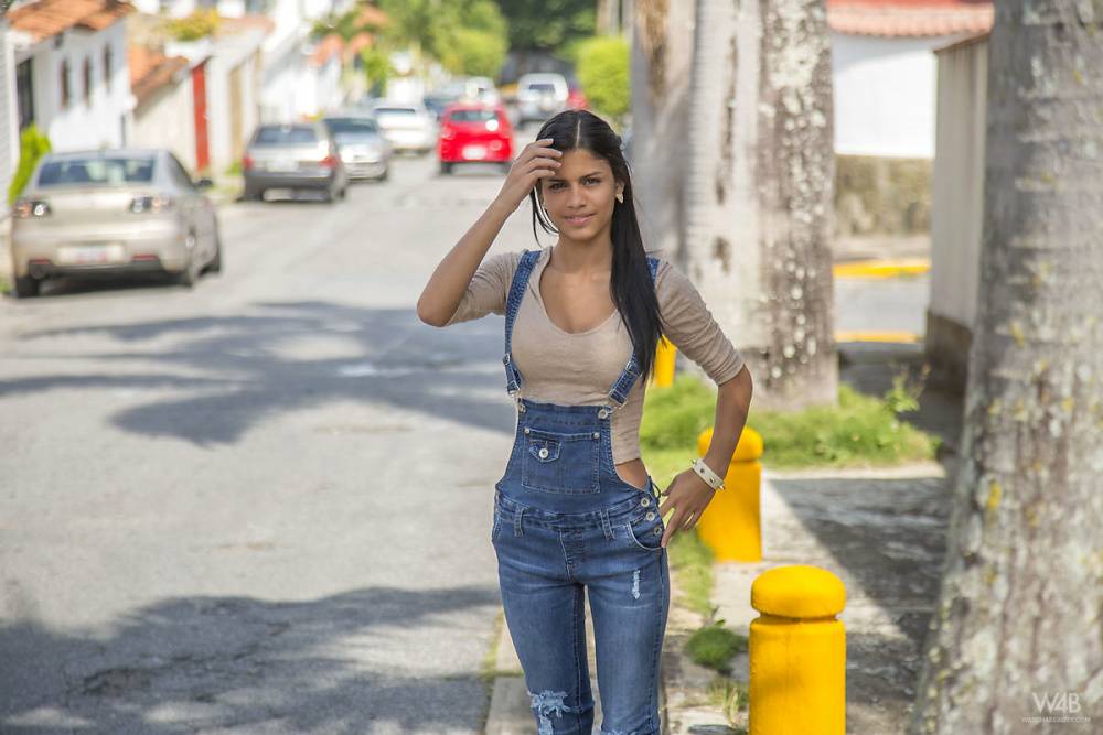 Clothed brunette teen Denisse Gomez shows off her pretty face in jean overalls - #15