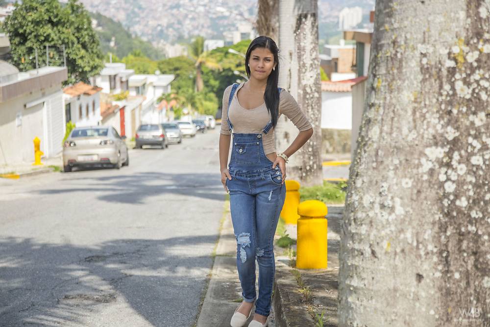 Clothed brunette teen Denisse Gomez shows off her pretty face in jean overalls - #8