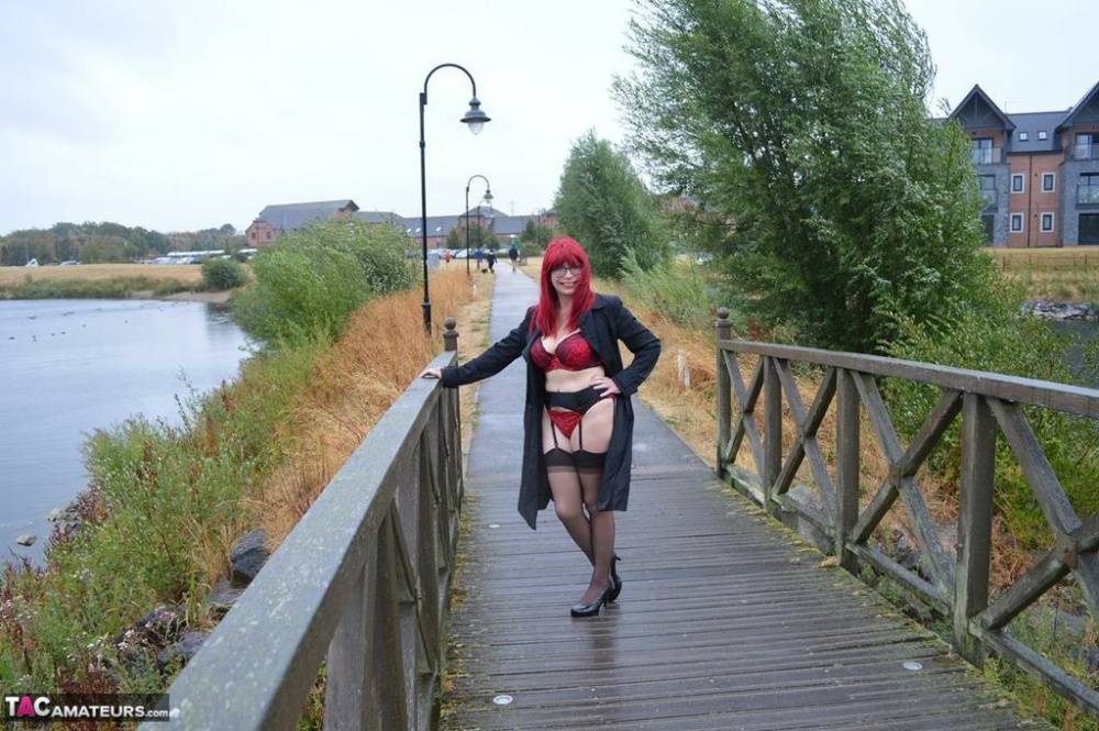 Mature redhead Barby Slut gets naked in public places on a wet day - #6