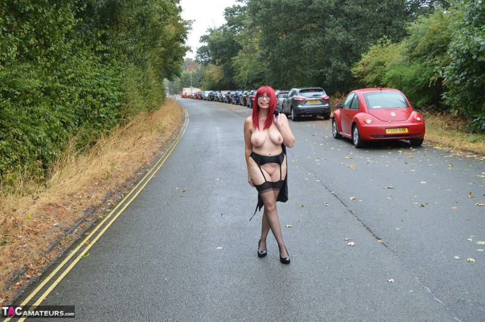 Mature redhead Barby Slut gets naked in public places on a wet day - #1