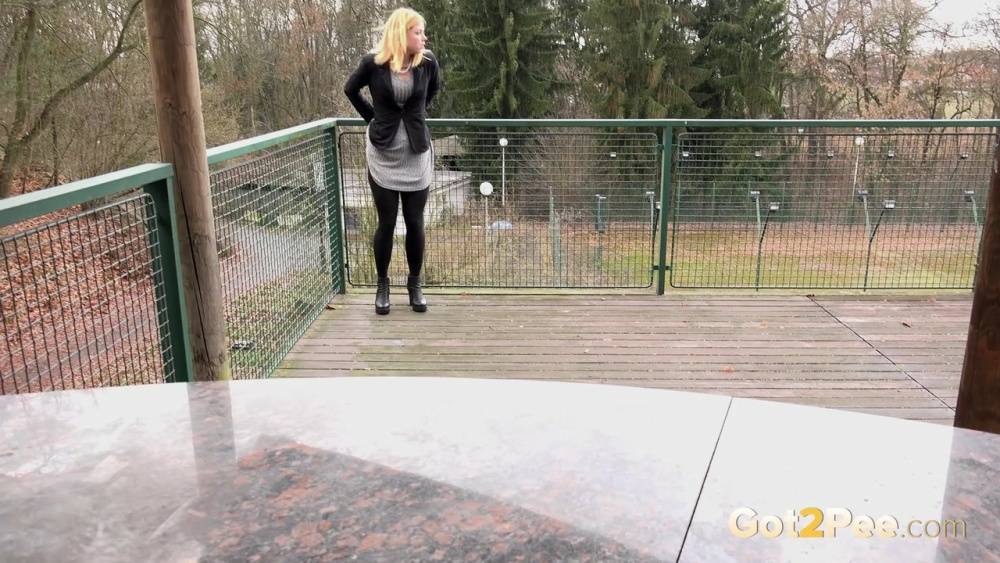 Blonde Chrissy gets short taken and pisses squatting on the deck - #5