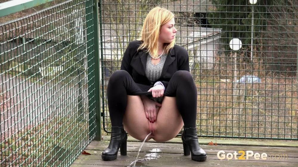 Blonde Chrissy gets short taken and pisses squatting on the deck - #11