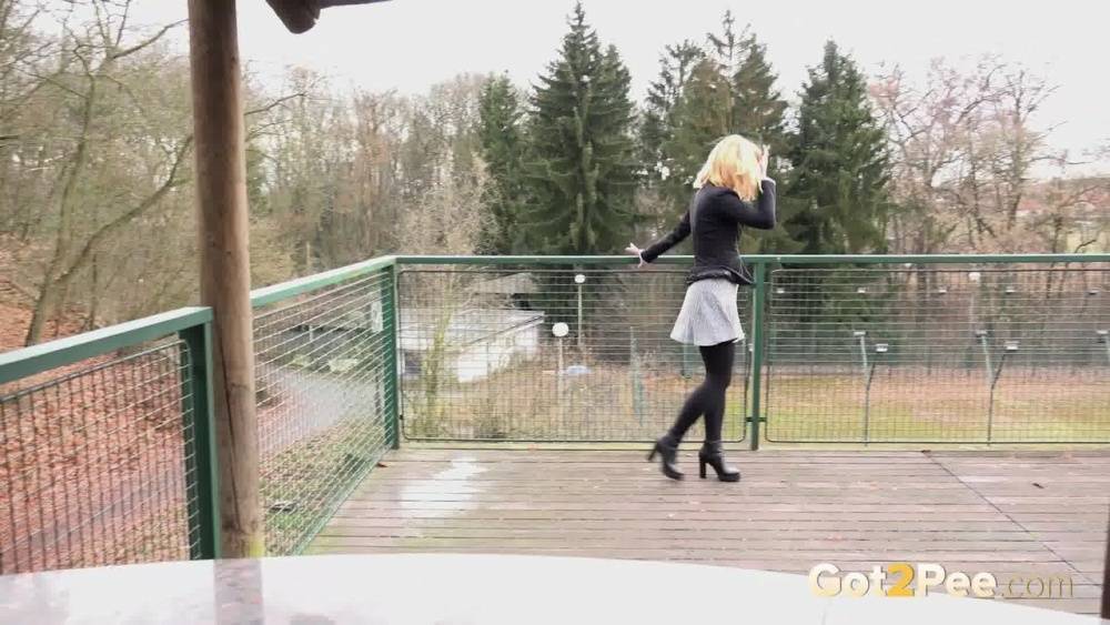 Blonde Chrissy gets short taken and pisses squatting on the deck - #7