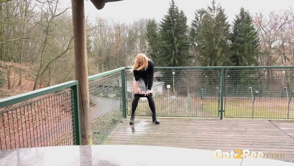 Blonde Chrissy gets short taken and pisses squatting on the deck - #3