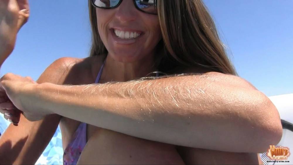 Amateur chick Lori Anderson tugs on her hairy arms in a bikini and shades - #13