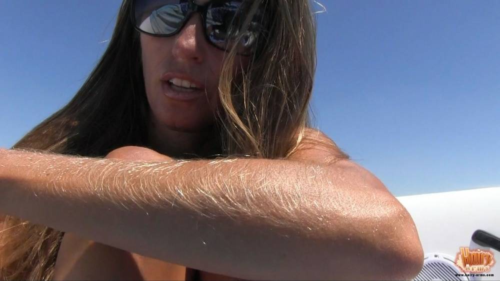Amateur chick Lori Anderson tugs on her hairy arms in a bikini and shades - #11