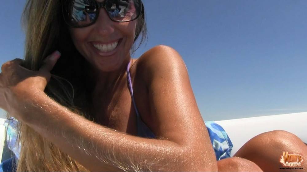 Amateur chick Lori Anderson tugs on her hairy arms in a bikini and shades - #5